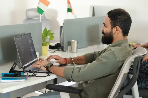 A working professional at his office desk